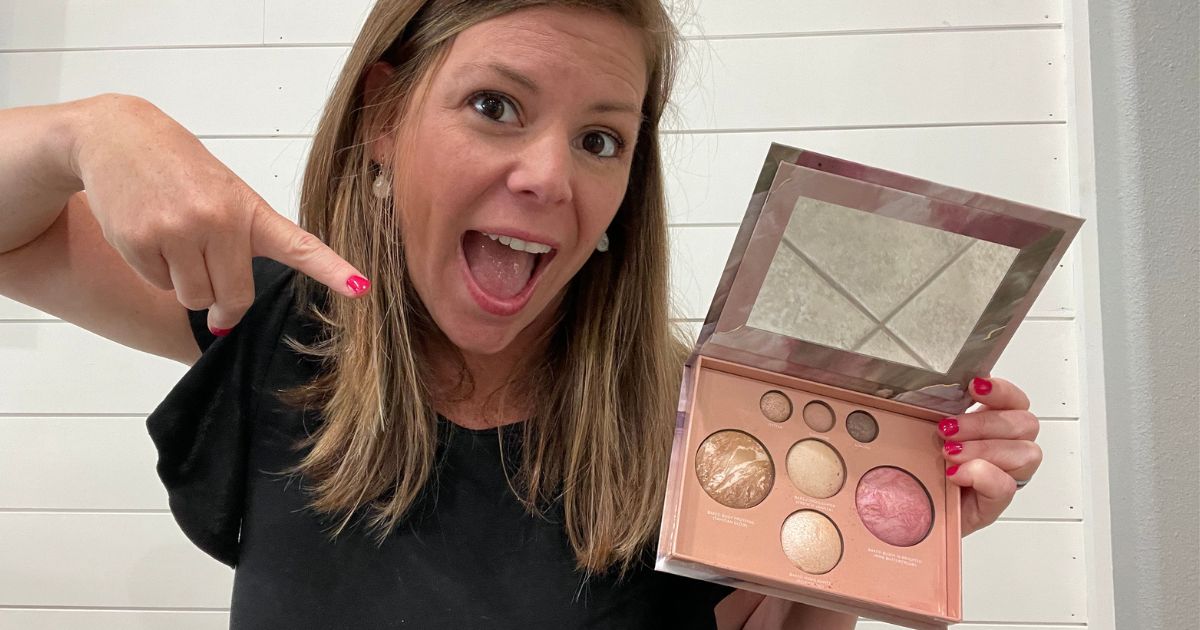 Woman very excitedly pointing at a makeup palette