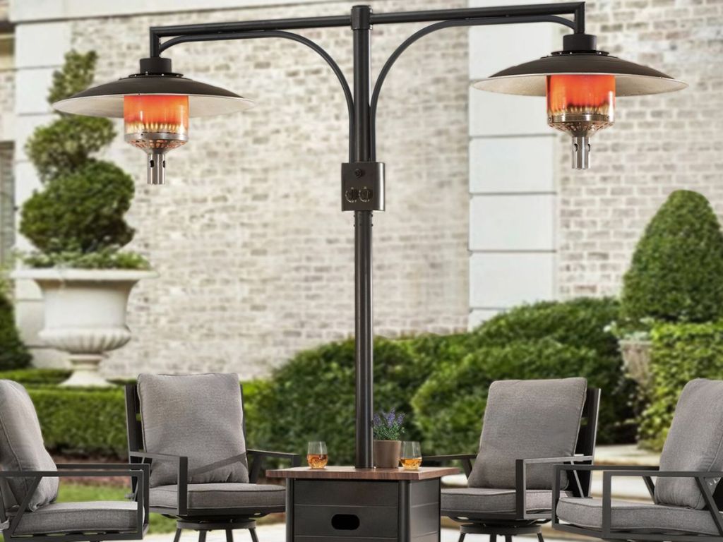A floorstanding propane heater in the center of a patio set