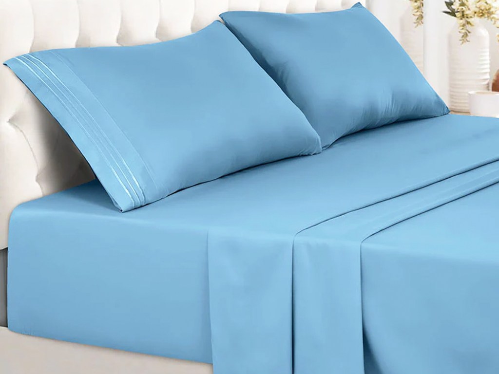 blue sheets and pillowcases on bed