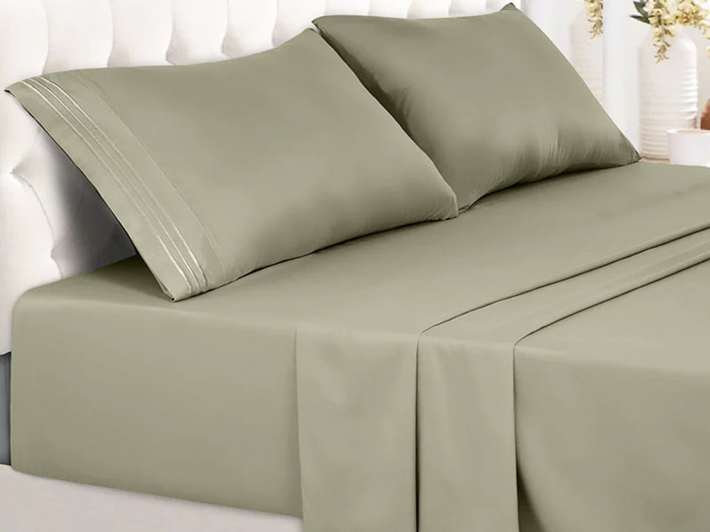 olive green sheets and pillowcases on bed