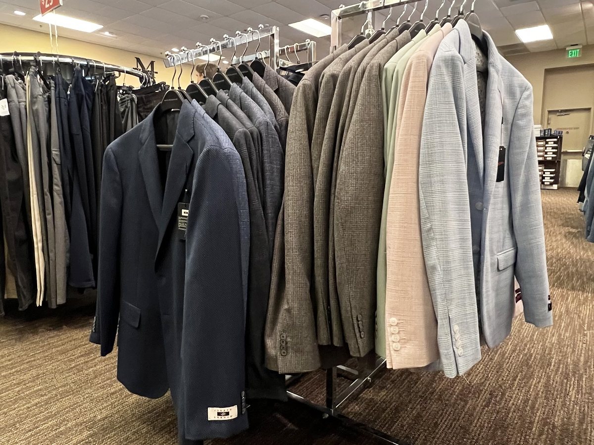 men's sport coats on store display rack