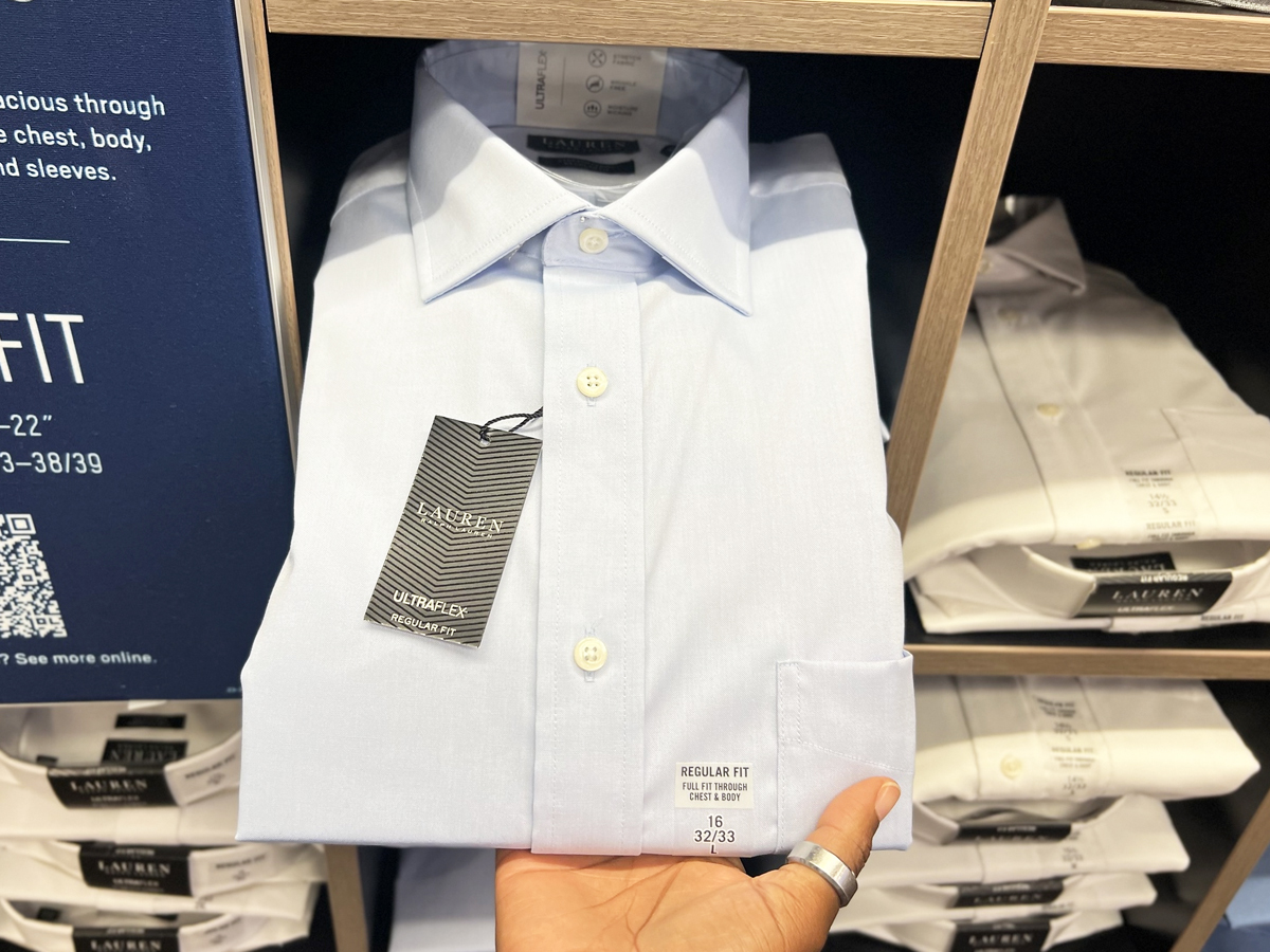 hand grabbing a men's dress shirt