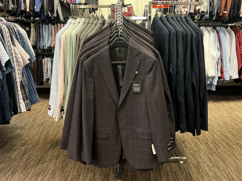 men's sport coats on store display rack