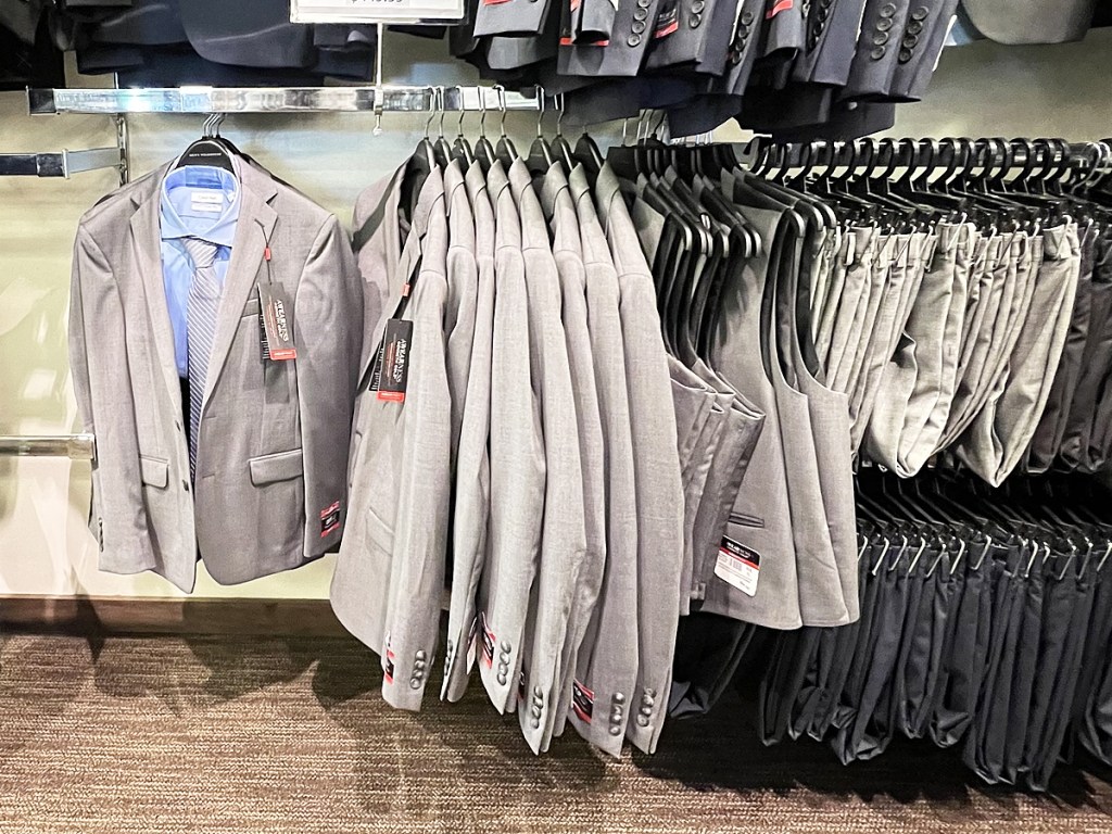 sport coats, vests, and pants on store display rack