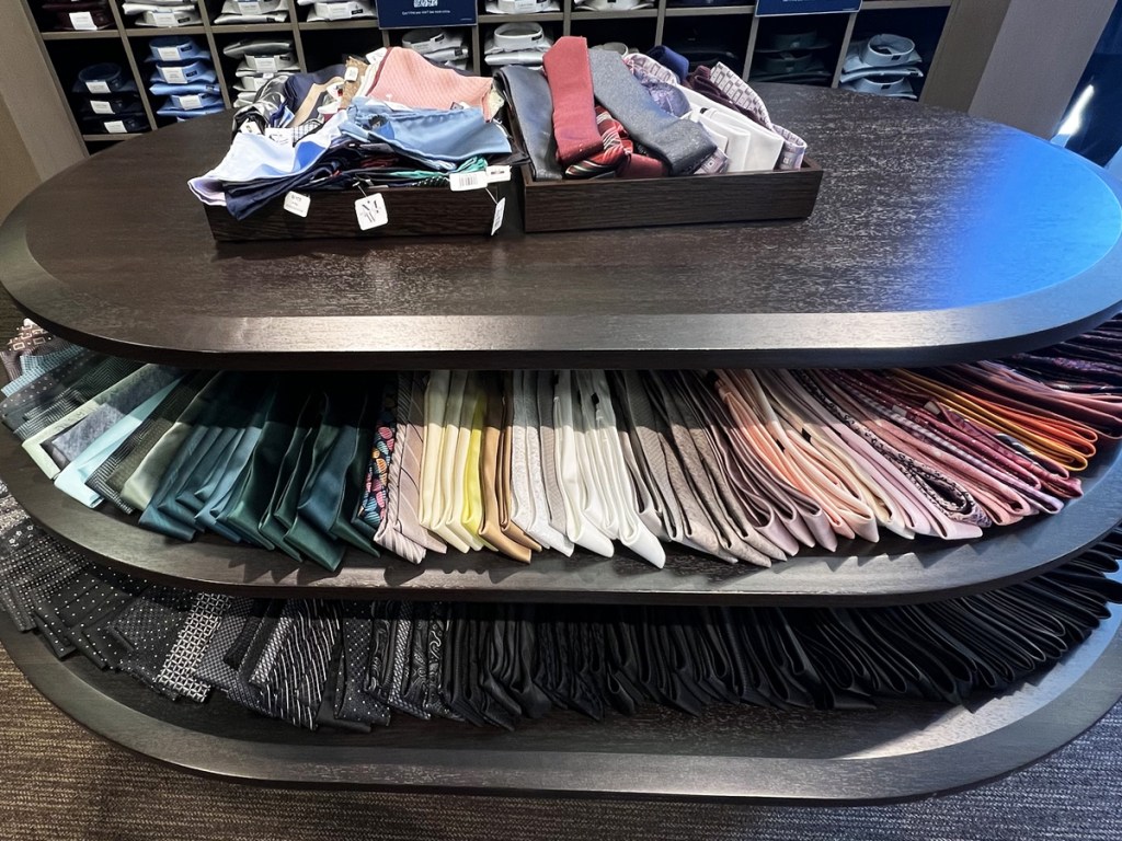 display table full of men's ties on display