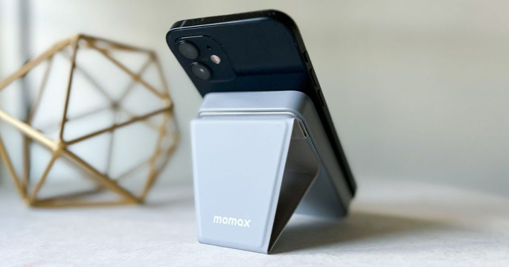 An iPhone on a Momax charging stand