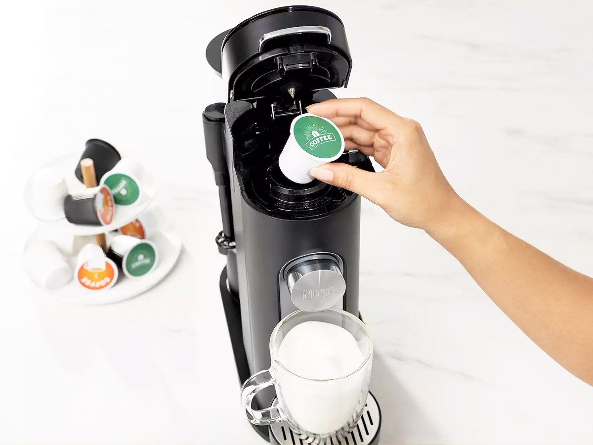 Single serve coffee maker with online frother