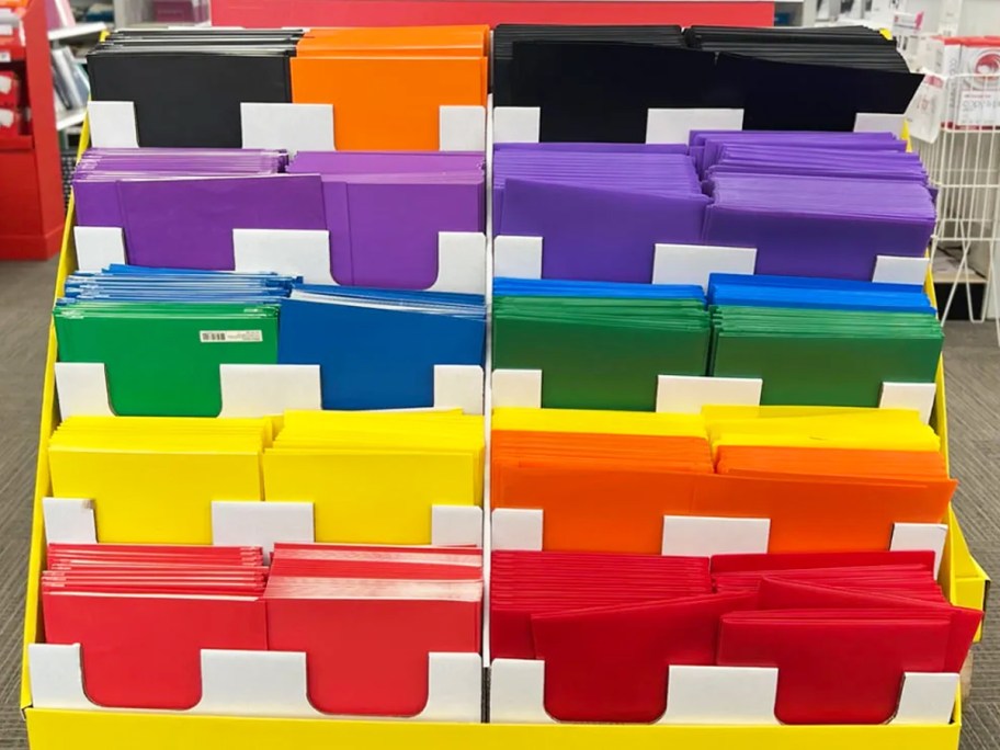 multi colored folders on stand in office depot