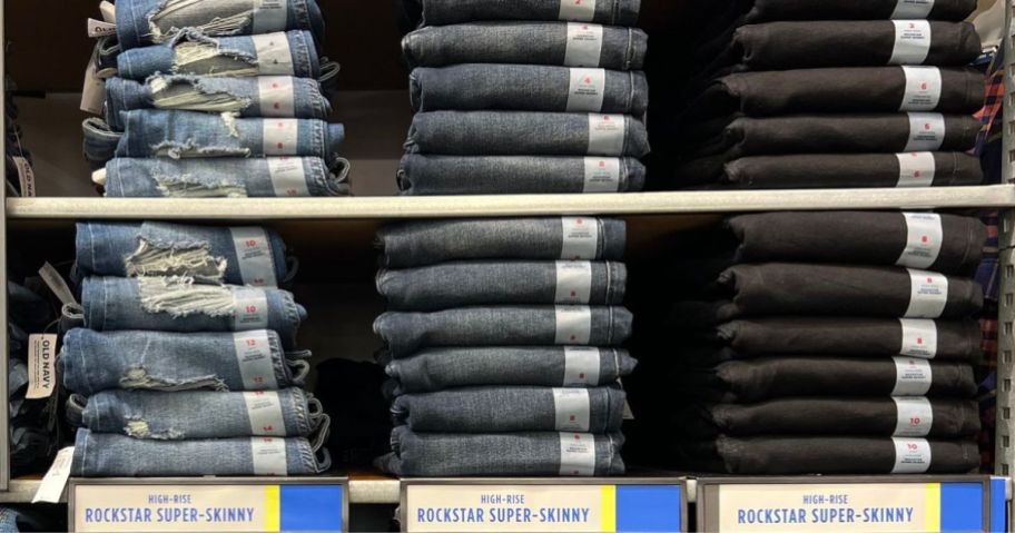 A wall of folded old navy women's jeans at the store