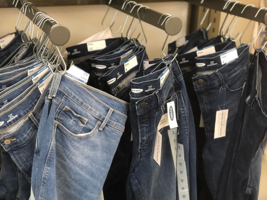 row of Old navy women jeans handing on clips