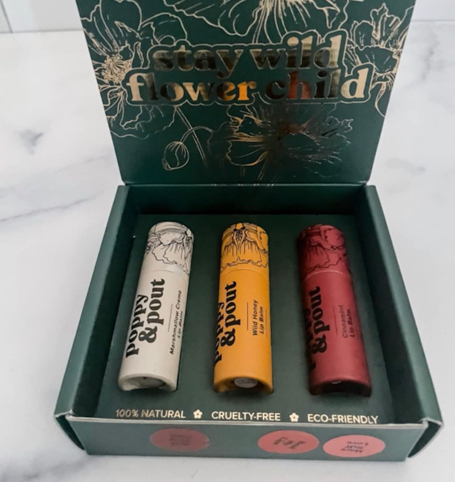 gift box of poppy and pout lip balm with sticks inside