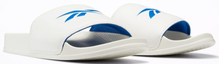 pair of white and blue reebok slides