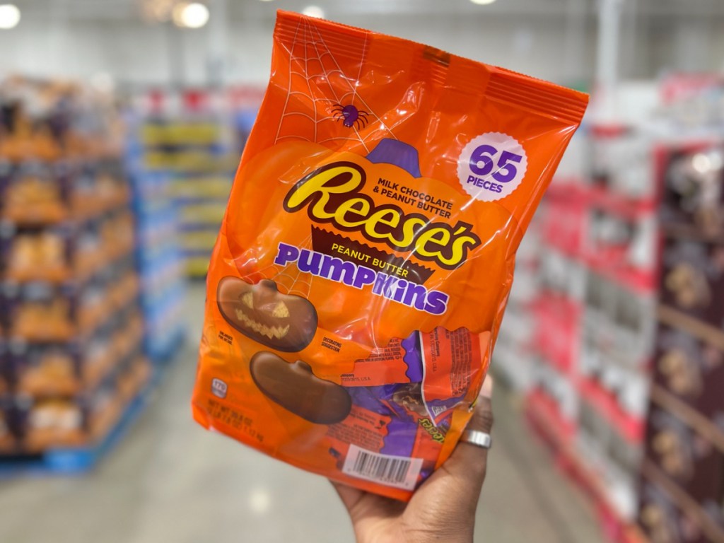 Reeses pumpkin chocolate bag in womans bag at the store 