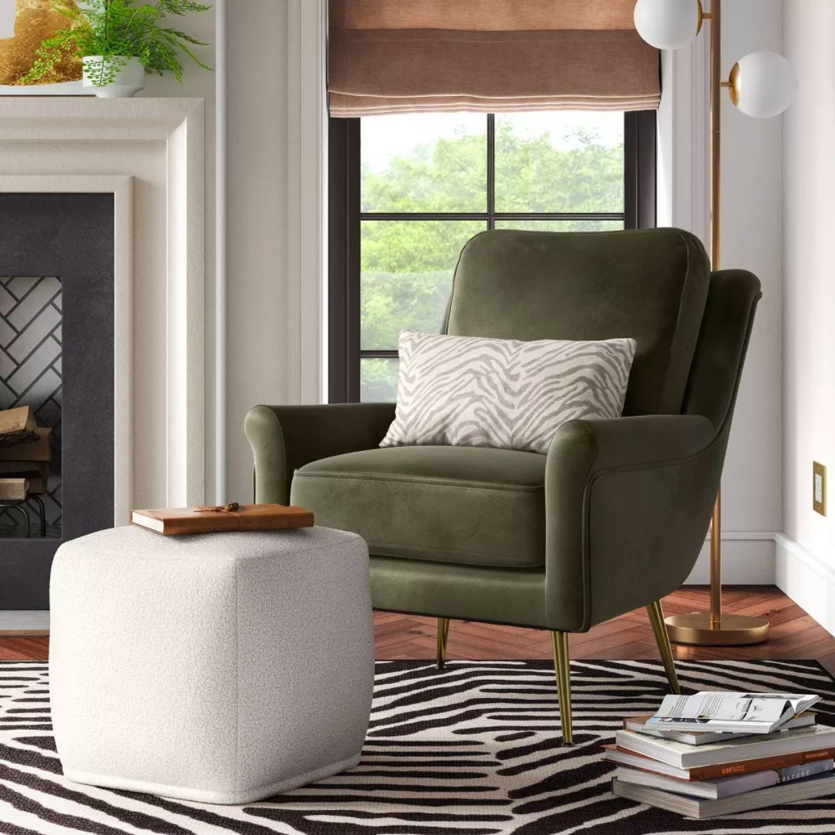 Roper Teddy Pouf in front of a green velvet accent chair