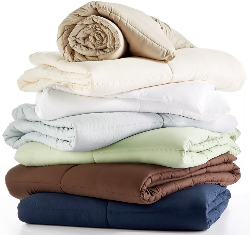 stack of folded comforters