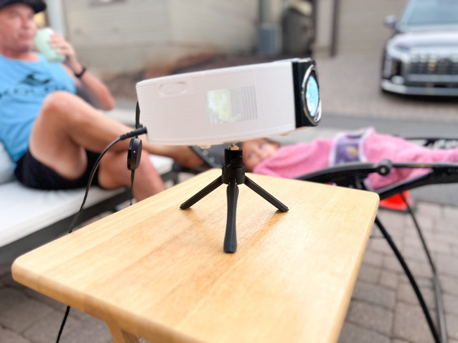 Sainyer Outdoor 4K Mini Projector on table top outside