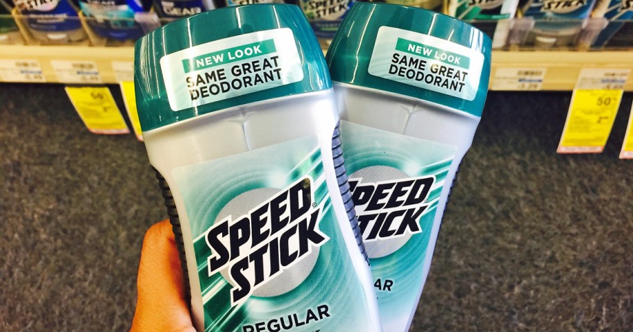 hand holding two sticks of Speed Stick Men's Deodorant in store