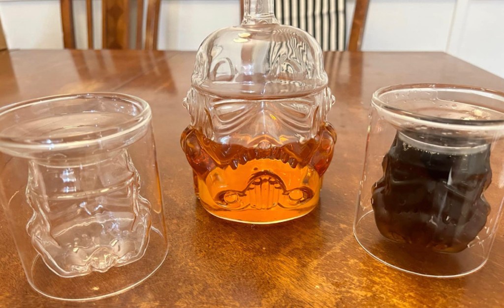 glass star wars shaped decanter set on wood table