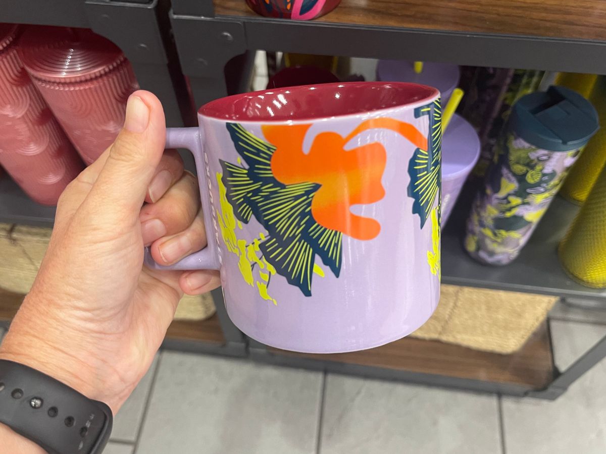 starbucks mug in hand