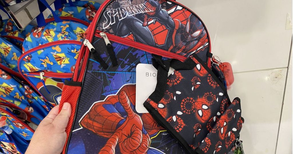 Hand holding a Spiderman backpack set from Macy's