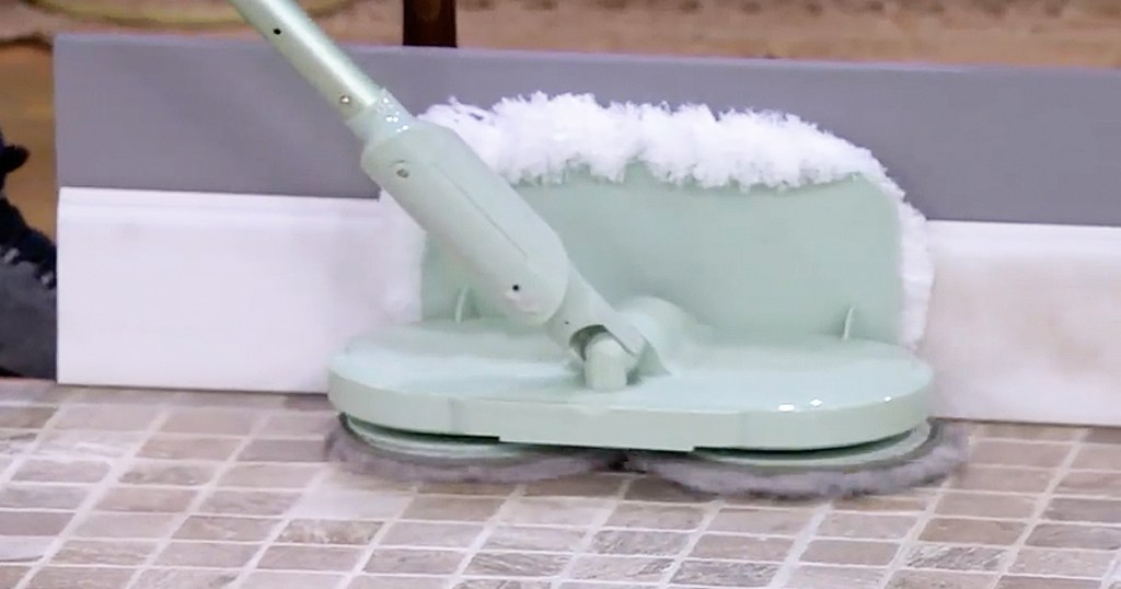 light green cordless mop cleaning baseboards