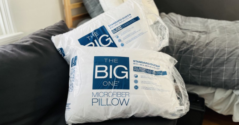 two big one bed pillows on bed
