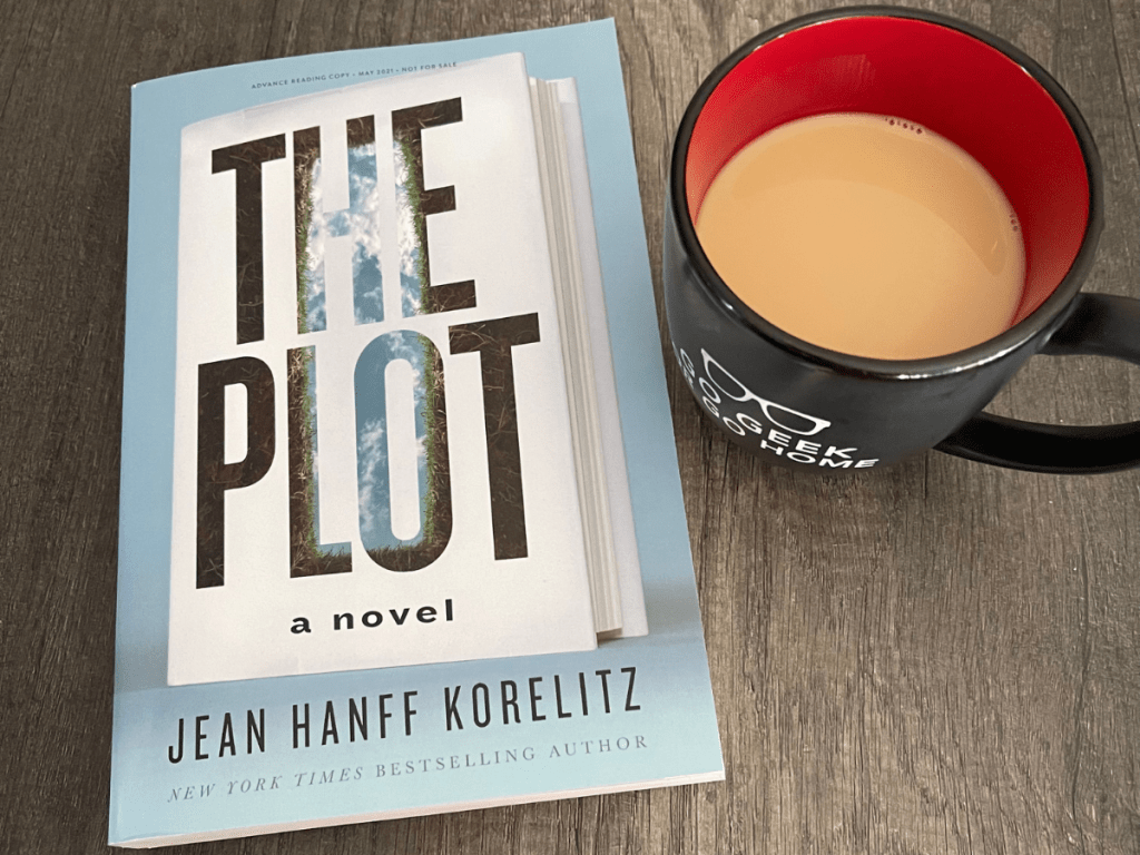 The Plot by Jean Hanff Korelitz with a cup of coffee