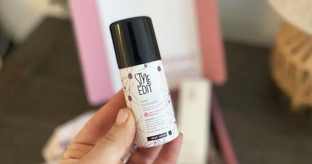 hand holding up a Travel-Size Style Edit Root Concealer Touch-Up Spray