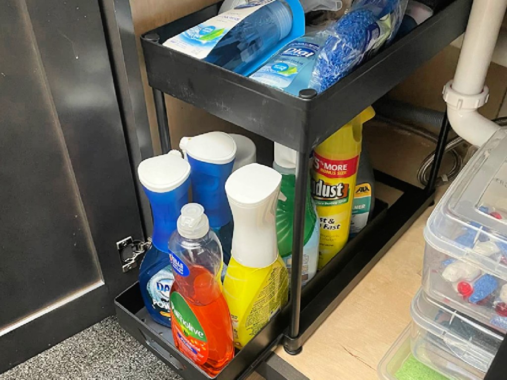 Under Sink Organizer filled with household cleaning products