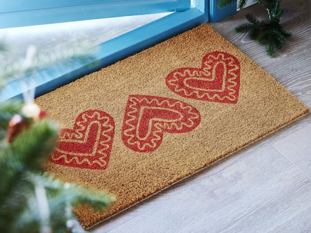 coir doormat with red hearts on door step