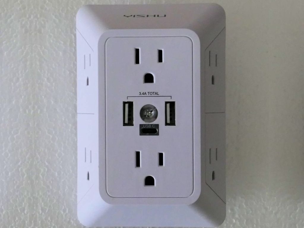 YISHU Outlet Extender plugged into a wall