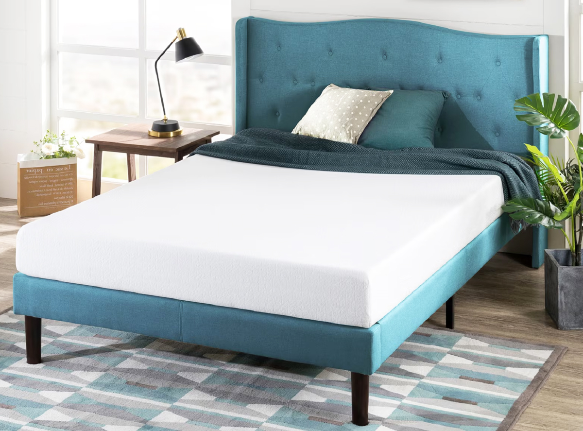 memory foam mattress on a blue platform bed