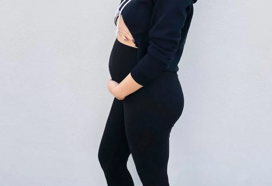 woman modeling black maternity leggings