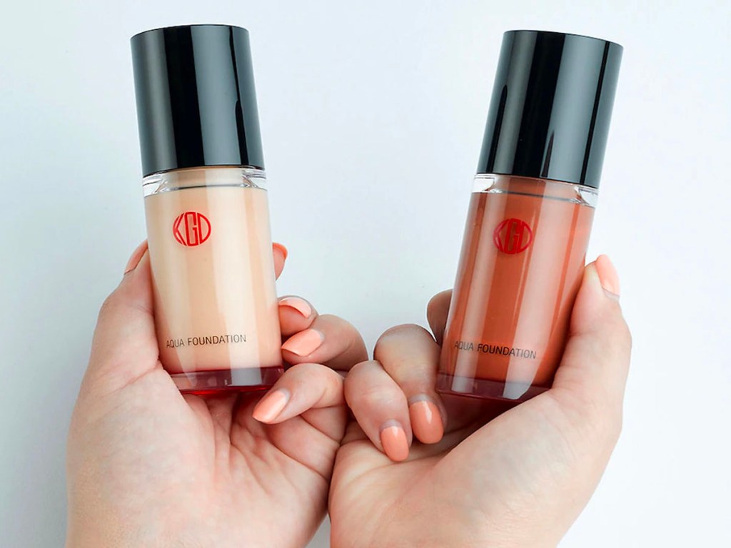 hands holding aqua foundation