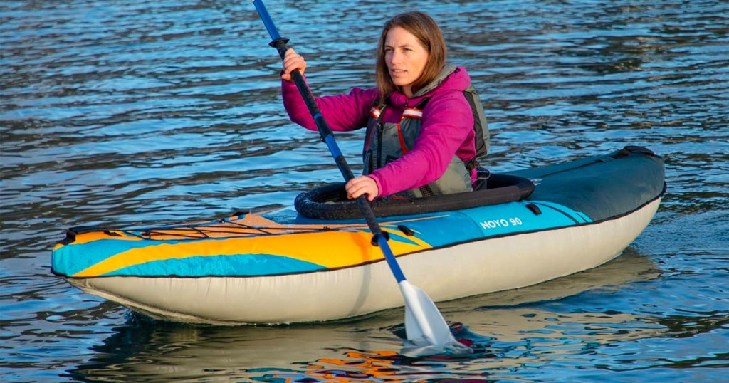 woman kayaking in lake