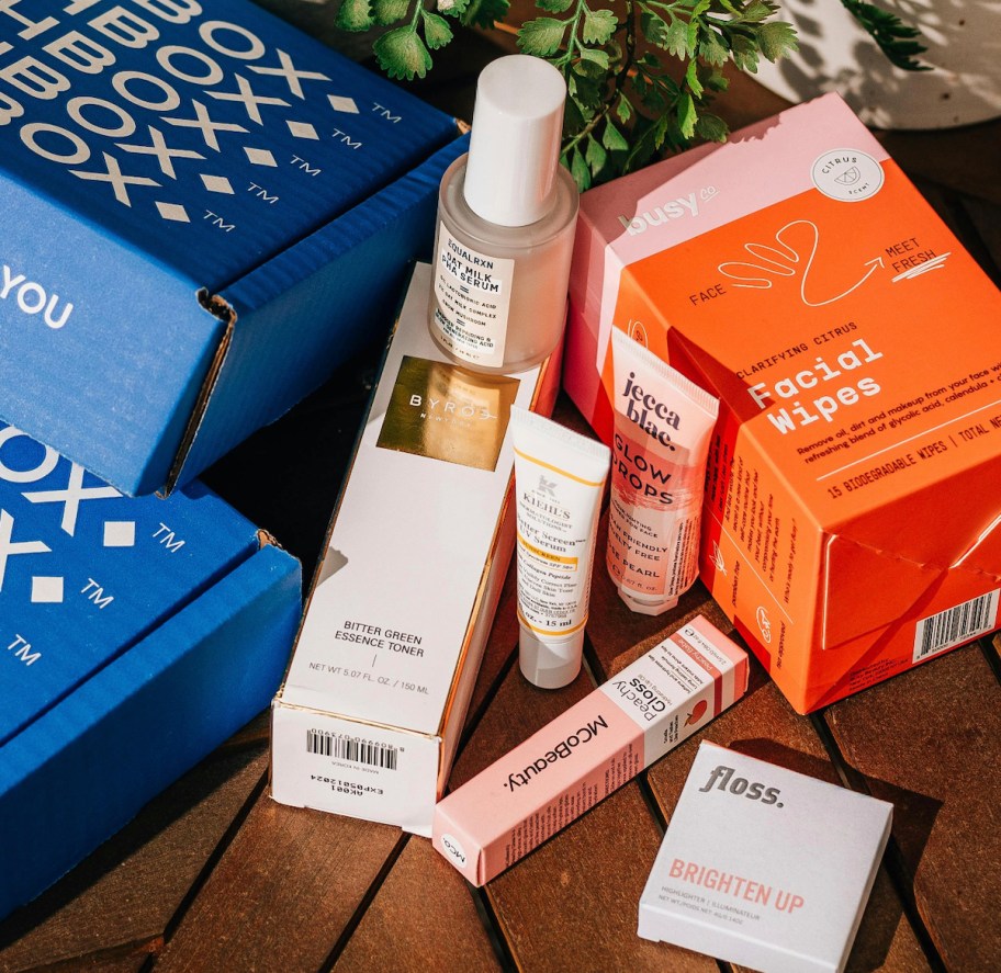 birchbox boxes and beauty products on wood table