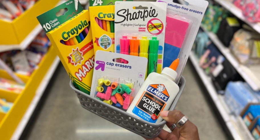 brightroom basket filled with school supplies in woman's hand