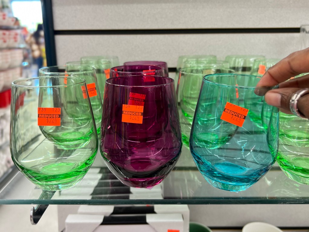 green, purple and blue glasses on shelf