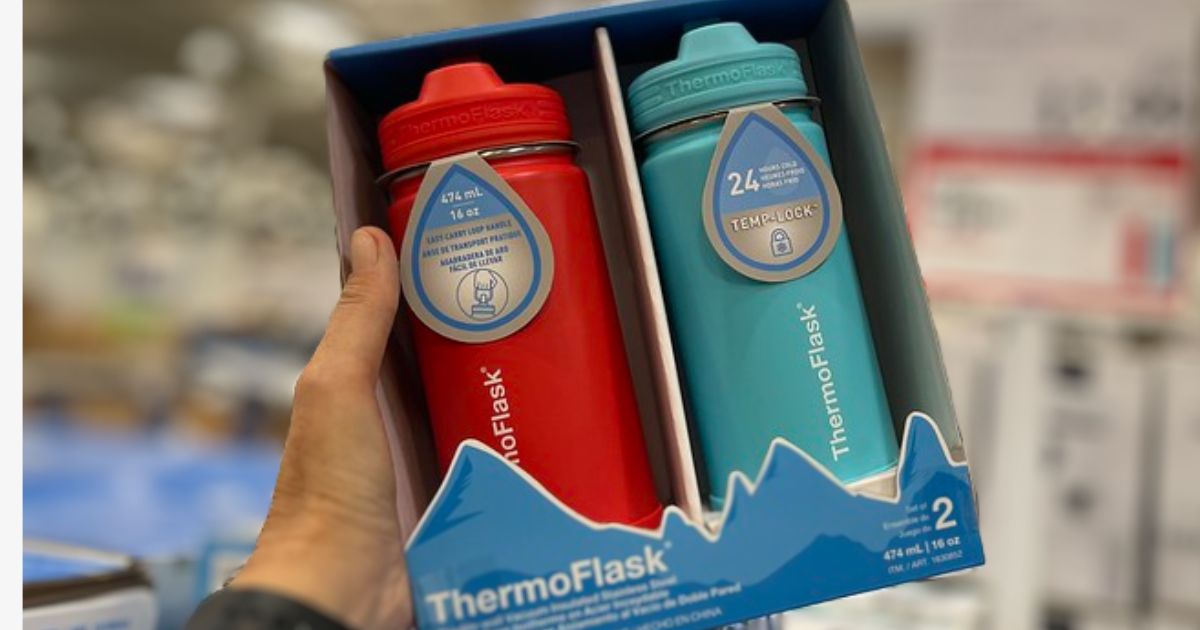 a womans hand holding costco thermo flask 2-pack