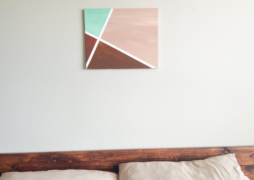 geometric lines painting above bed