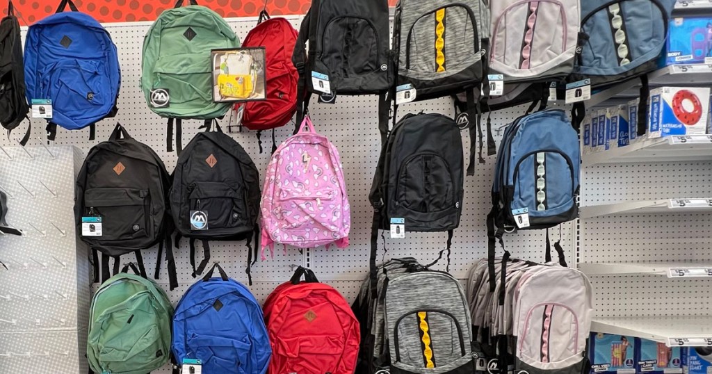 lots of backpacks hanging in store