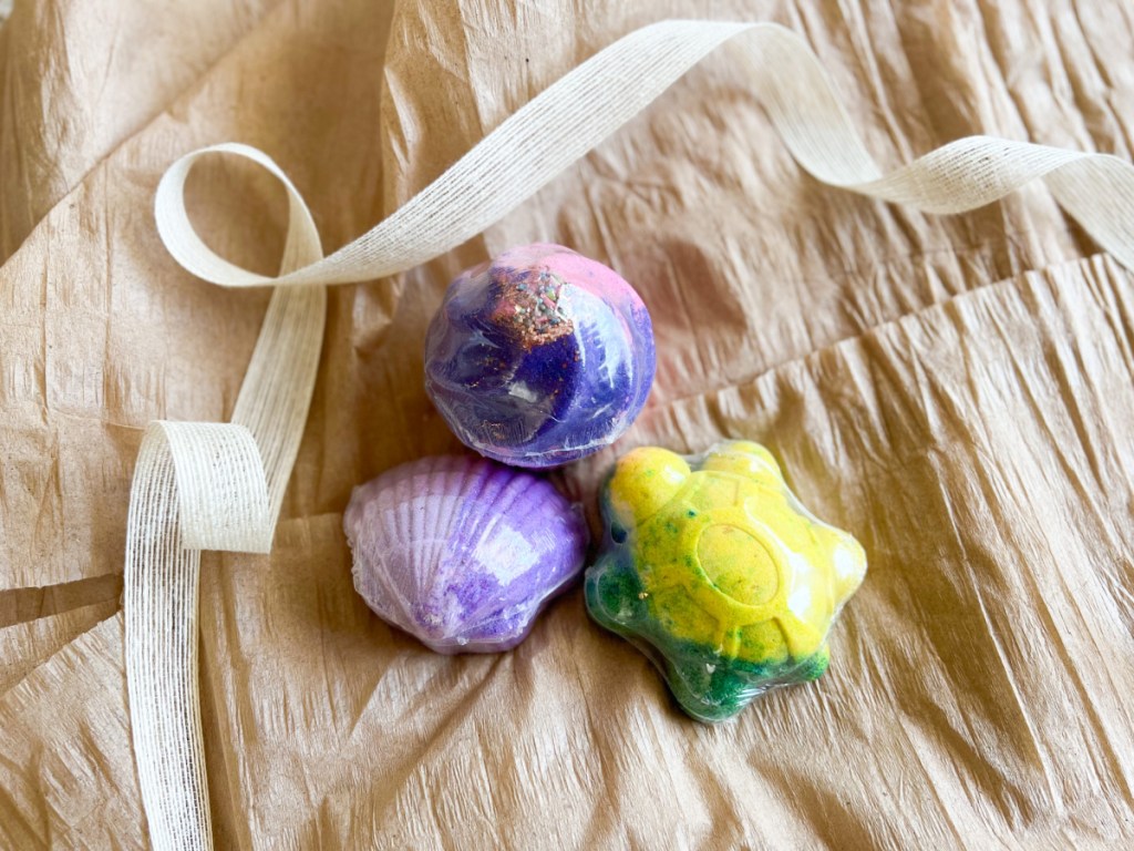 bath bombs on gift wrap with ribbon