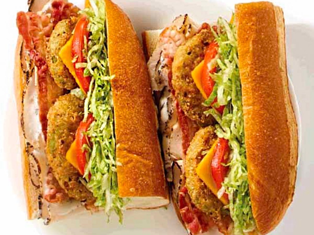 fried avocado and chicken sub cut in half