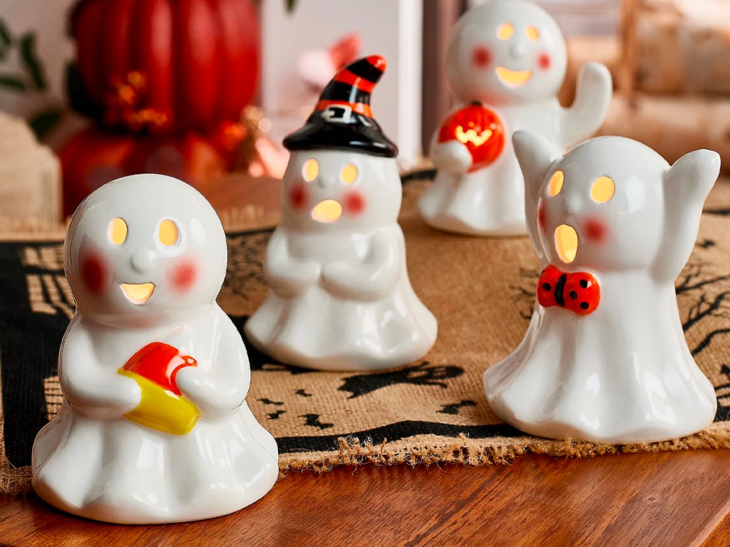 4 ceramic ghosts on table
