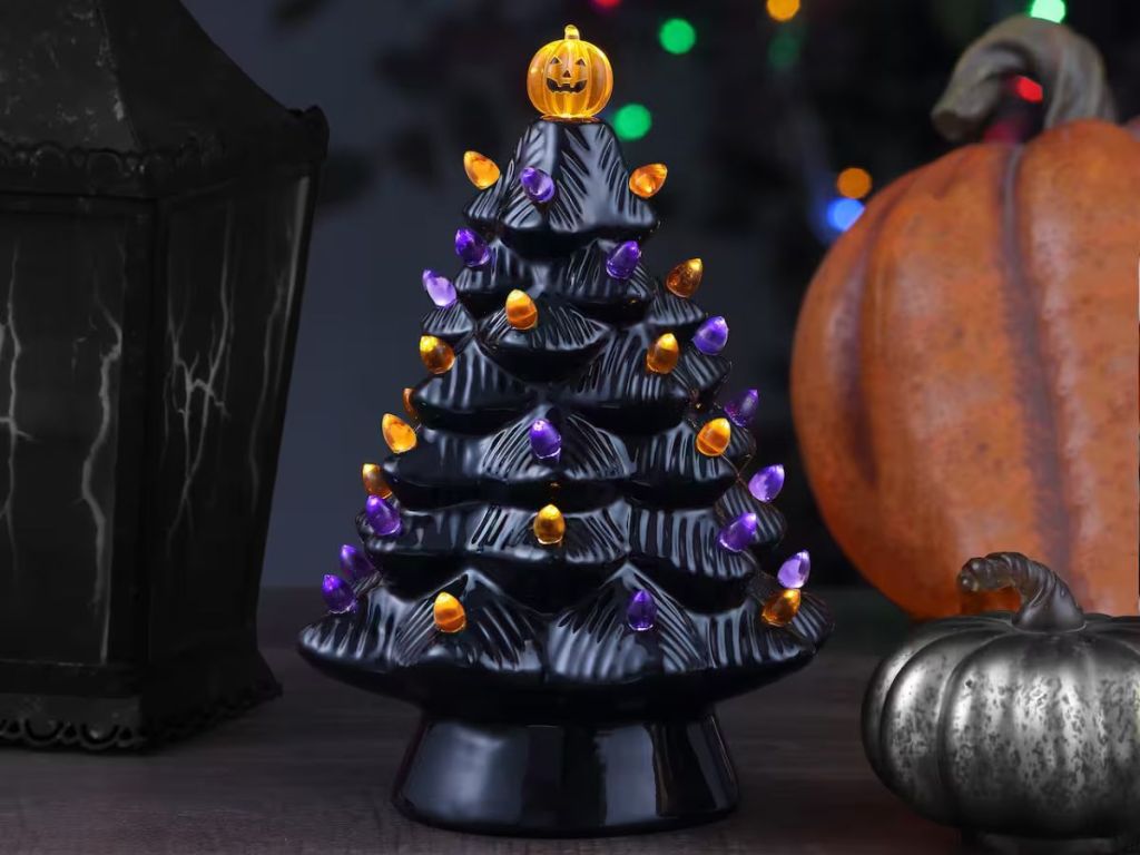 black ceramic Halloween tree with pumpkin tree topper