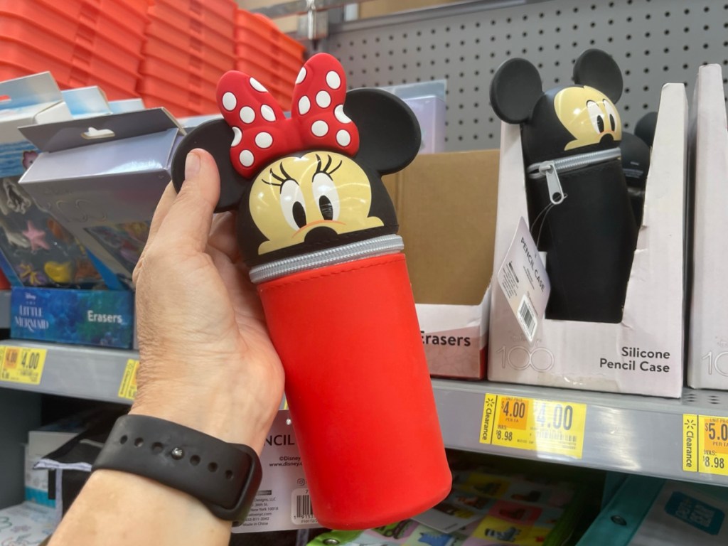 hand holding Minnie Mouse pencil holder