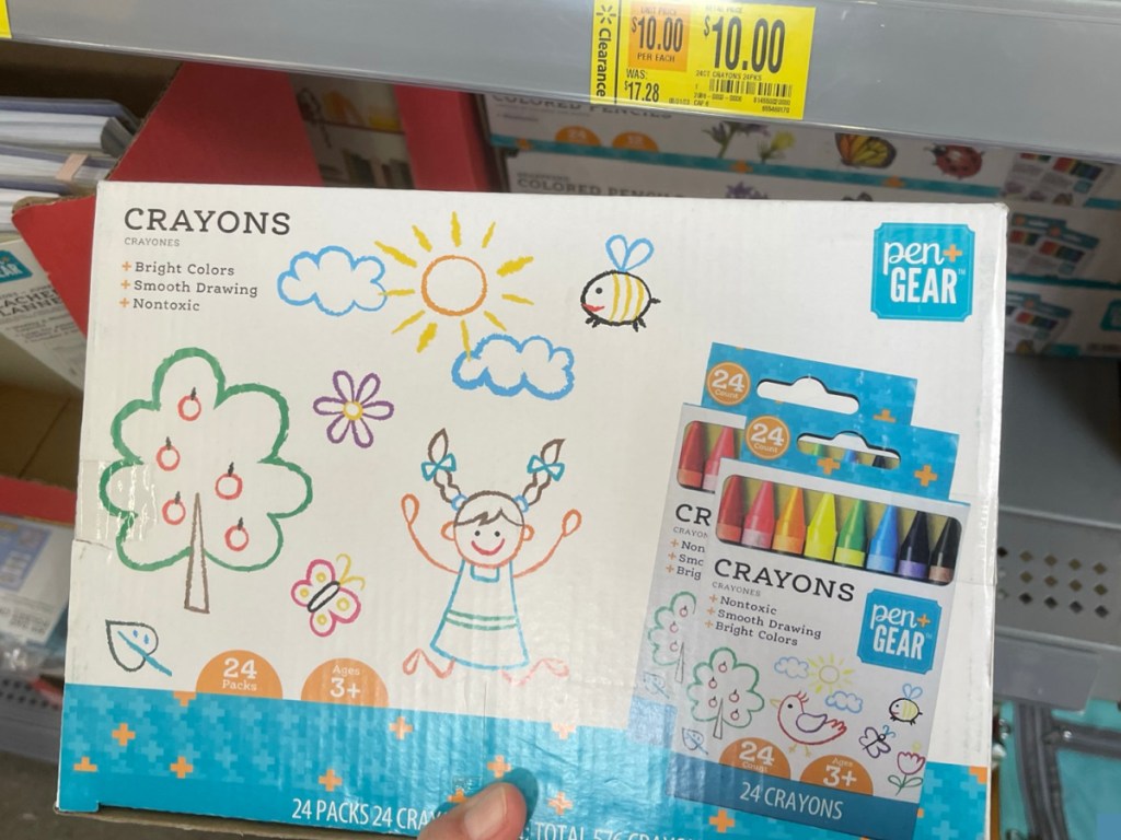 hand holding Pen+Gear Crayons 24-Packs of 24 Count Crayon Boxes