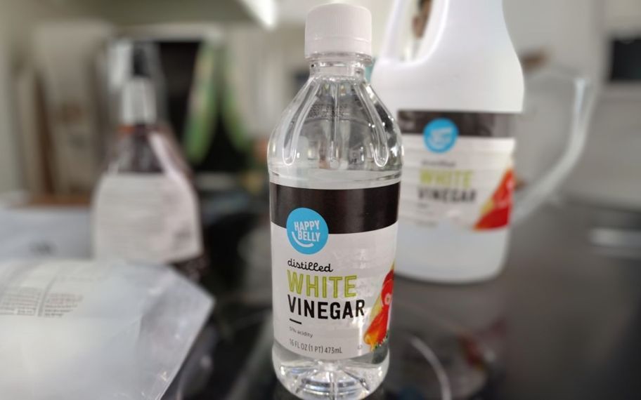 a bottle of happy belly white distilled vinegar on a kitchen counter top