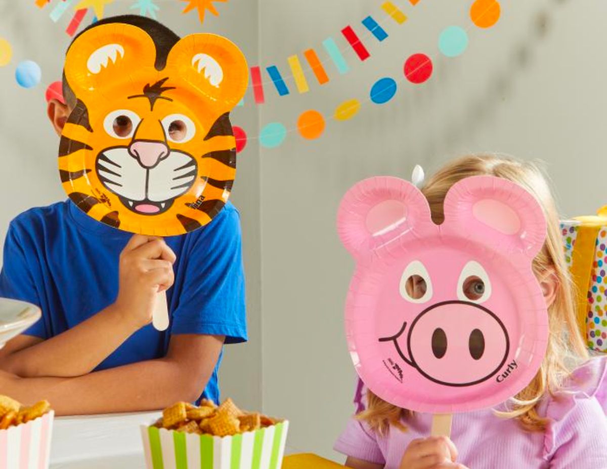 two kids wearing masks they made from hefty zoo pals plates and popsicle sticks