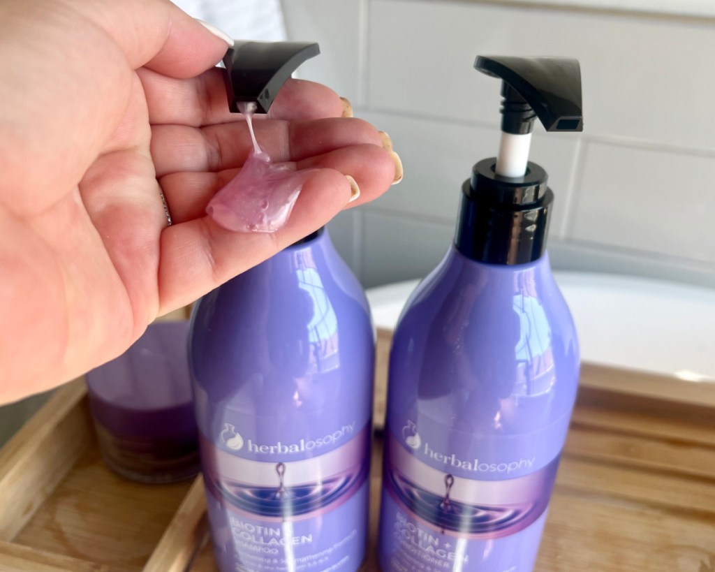 hand squeezing shampoo into palm